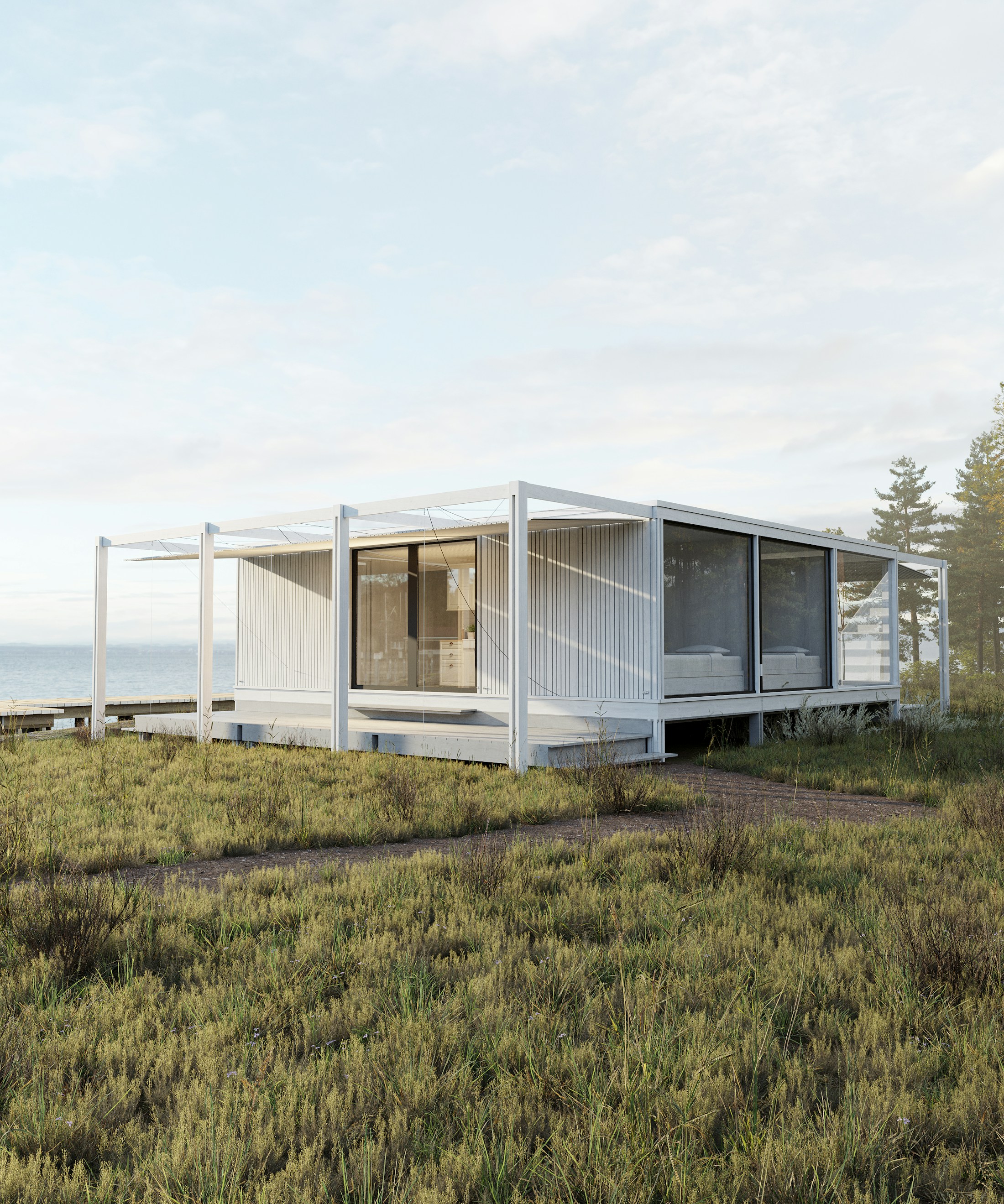 Lichte moderne architectuur tussen duingras, met uitzicht op zee